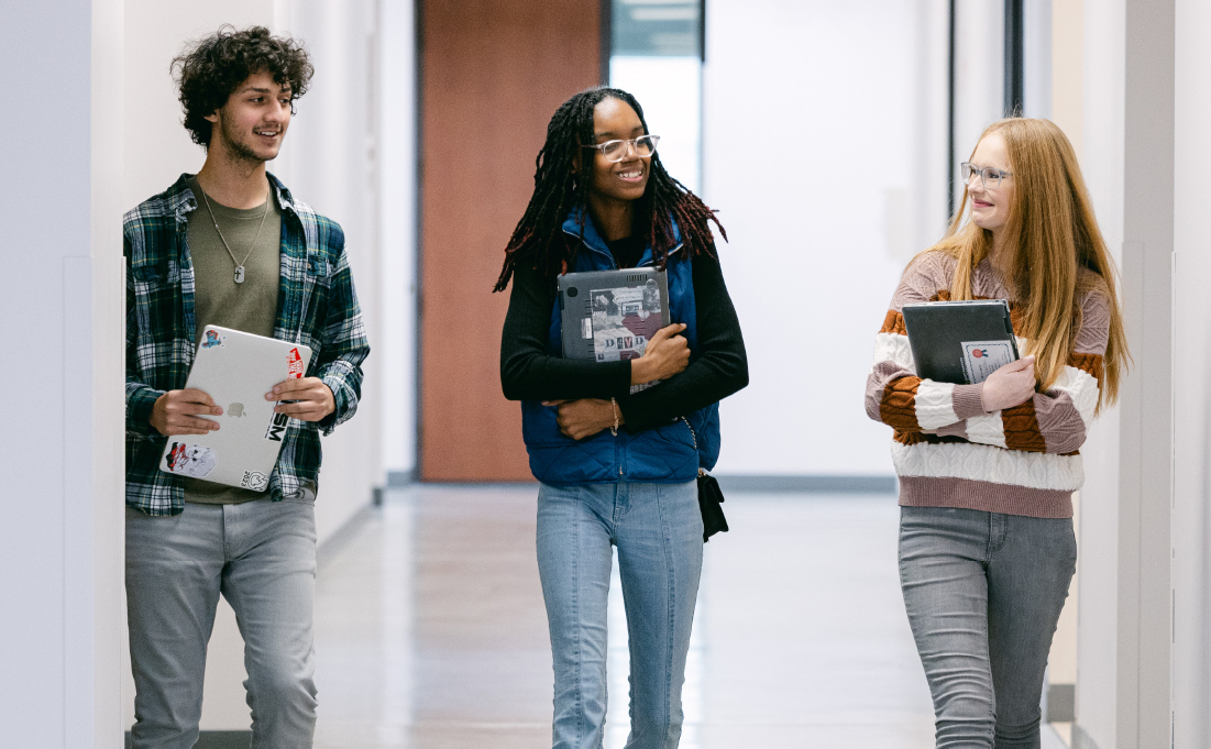 Students walking down hallway.
