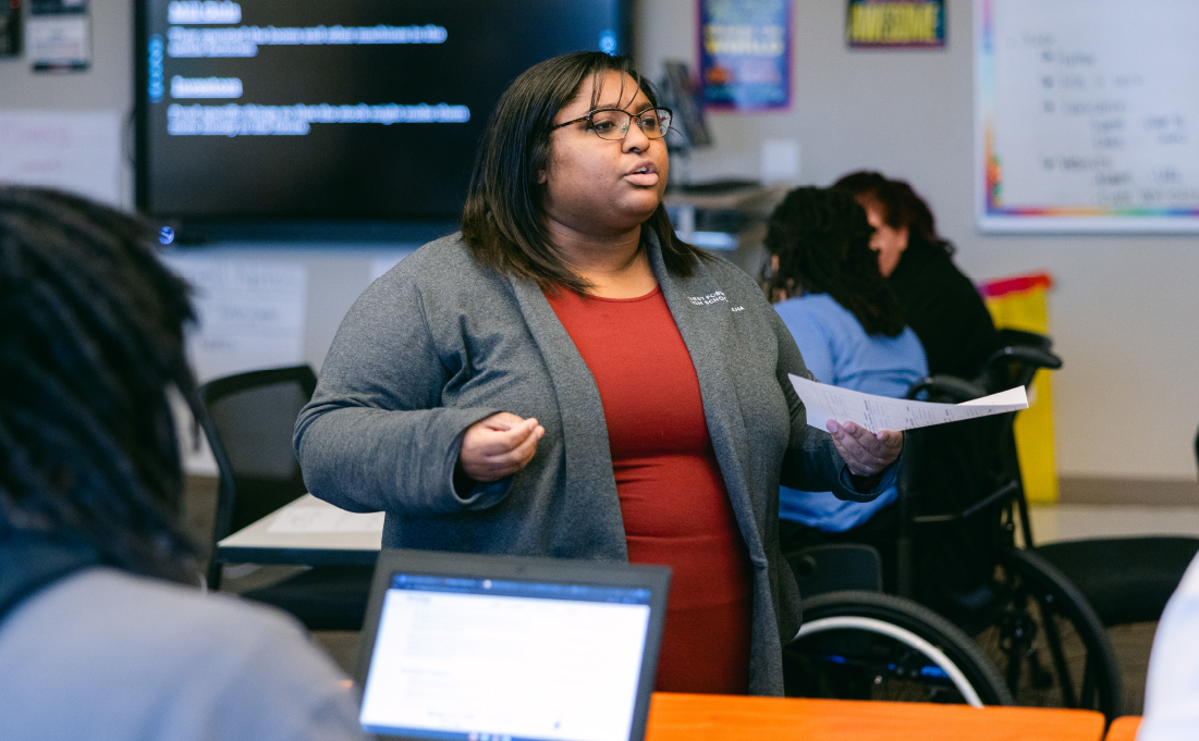 Teacher talking to class.