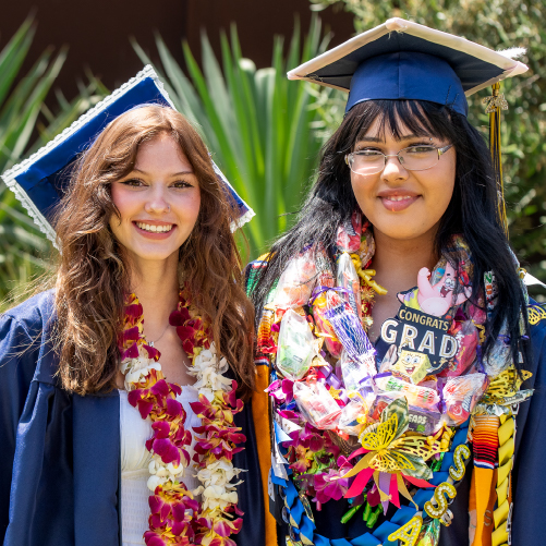 Students in graduation caps and gowns.